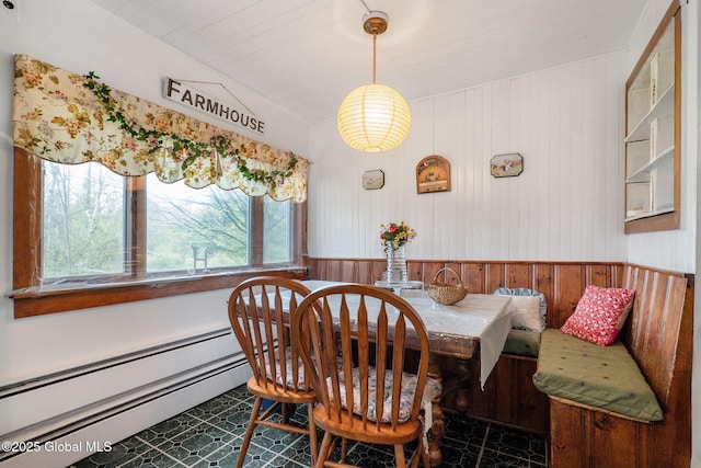 12098 Duanesburg Rd, Duanesburg, NY 12053 - dining room featuring a baseboard radiator, wainscoting, and wooden walls