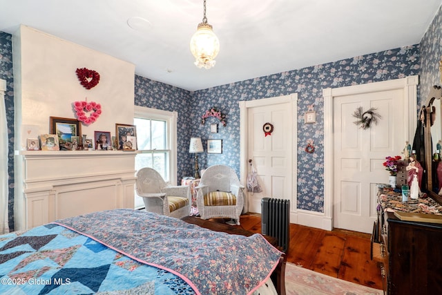 12098 Duanesburg Rd, Duanesburg, NY 12053 - bedroom with wallpapered walls, wood finished floors, radiator heating unit, and a chandelier