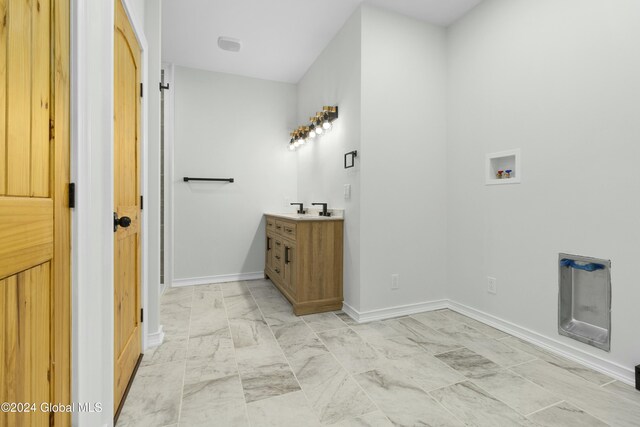 734 Groveside Rd, Pittstown, NY 12028 - bathroom featuring marble finish flooring, vanity, and baseboards