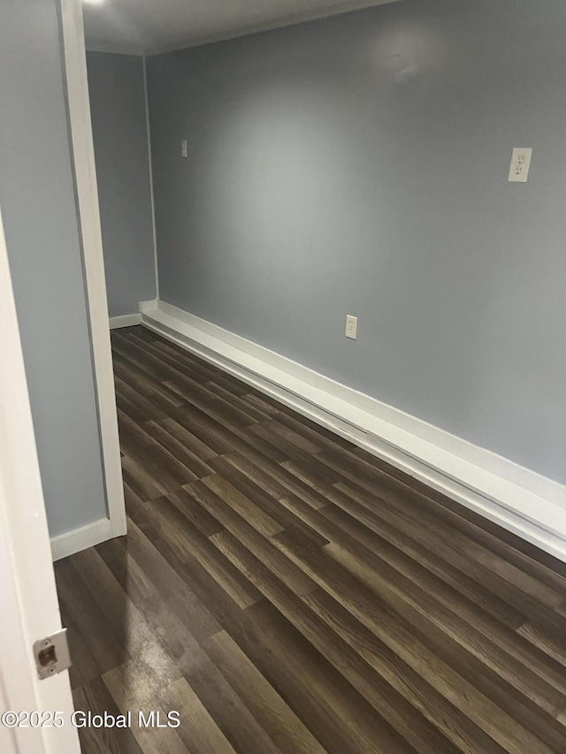 434 Old Stage Rd, Lake Luzerne, NY 12846 - empty room with dark wood finished floors and baseboards