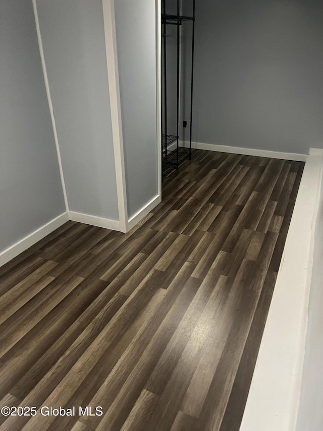 434 Old Stage Rd, Lake Luzerne, NY 12846 - empty room with dark wood-style floors and baseboards
