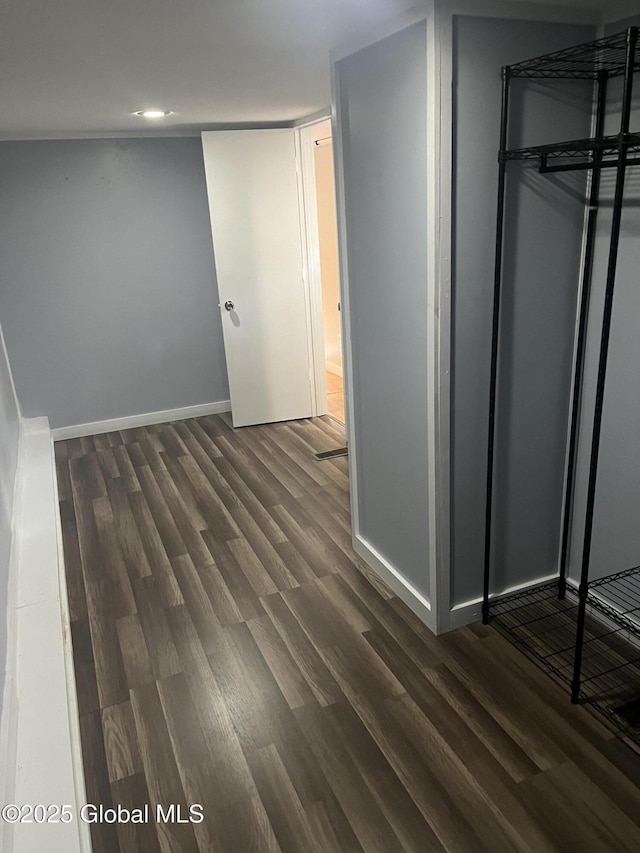 434 Old Stage Rd, Lake Luzerne, NY 12846 - unfurnished bedroom featuring dark wood-style floors and baseboards