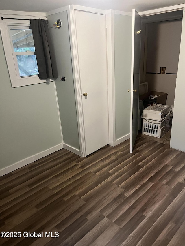 434 Old Stage Rd, Lake Luzerne, NY 12846 - unfurnished bedroom with dark wood-type flooring and baseboards