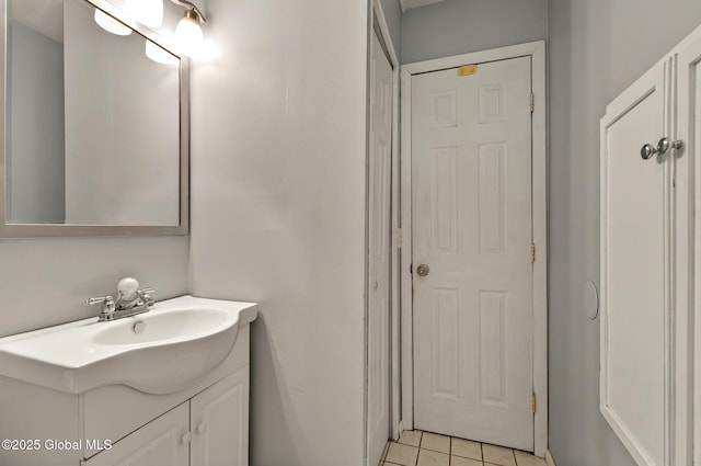 bathroom featuring tile patterned flooring and vanity