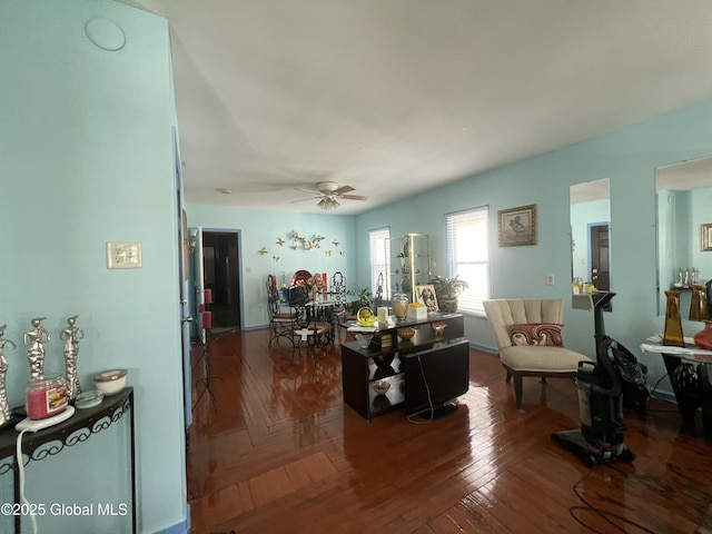 living area with ceiling fan and wood finished floors