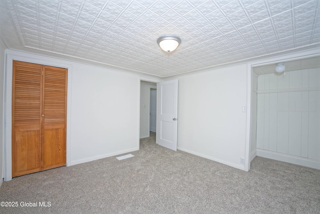 30 Andrewsville Ct, Watervliet, NY 12189 - unfurnished bedroom with carpet, an ornate ceiling, baseboards, a closet, and ornamental molding