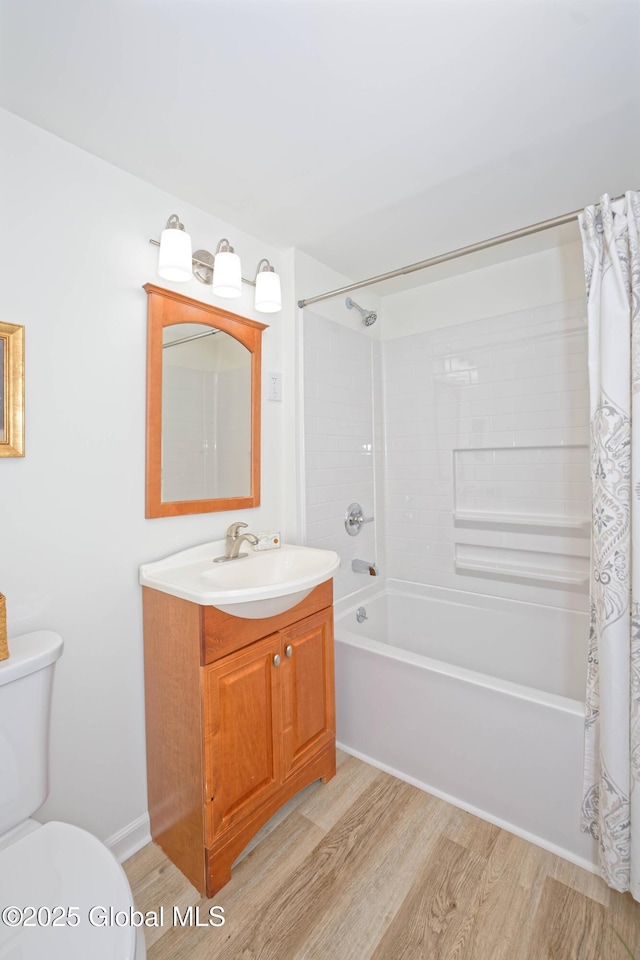 30 Andrewsville Ct, Watervliet, NY 12189 - bathroom with wood finished floors, shower / bath combo with shower curtain, vanity, and toilet