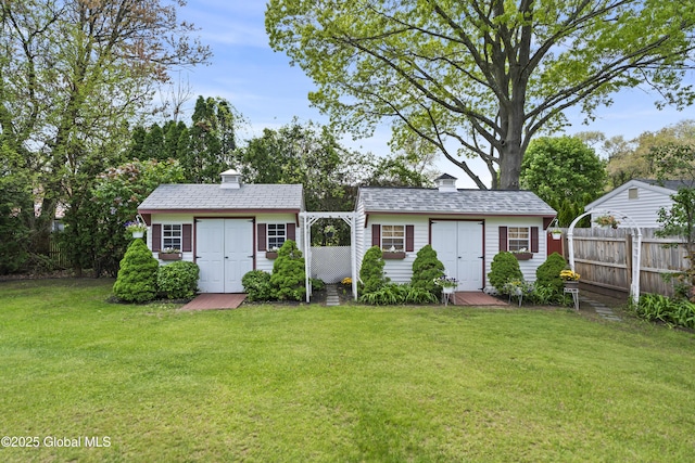 2125 Ferguson St, Rotterdam, NY 12303 - view of front of property with a chimney, an outdoor structure, and a storage shed