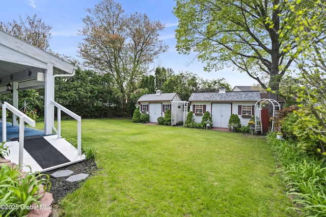 2125 Ferguson St, Rotterdam, NY 12303 - view of grassy yard with an outdoor structure