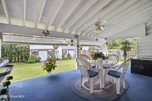 2125 Ferguson St, Rotterdam, NY 12303 - view of patio / terrace with outdoor dining area, an outbuilding, a ceiling fan, and a storage shed