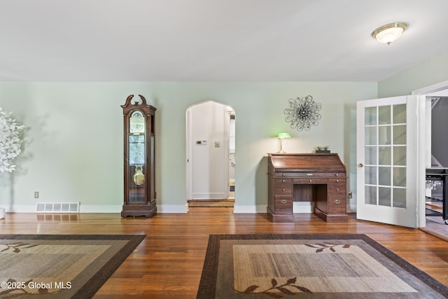 2125 Ferguson St, Rotterdam, NY 12303 - living room with wood finished floors, arched walkways, and baseboards