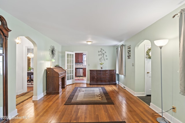 2125 Ferguson St, Rotterdam, NY 12303 - foyer entrance featuring arched walkways, hardwood / wood-style floors, and baseboards