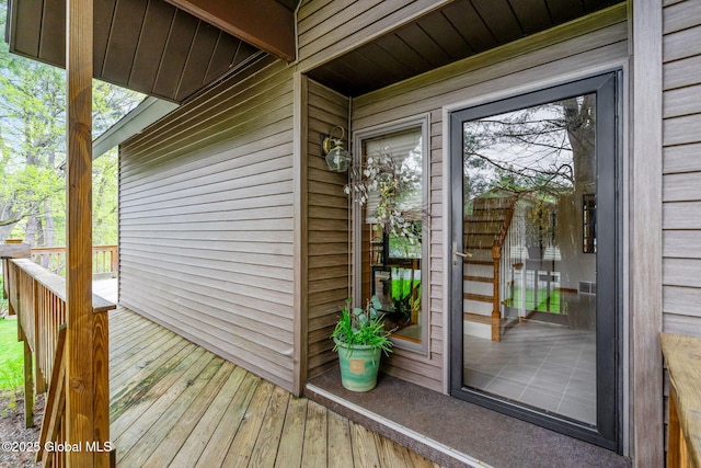 property entrance with a deck