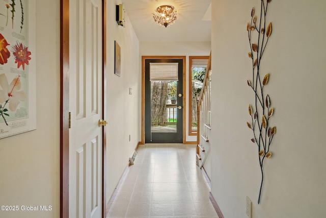 entryway featuring baseboards