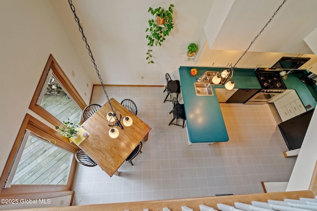 living room featuring tile walls and a wainscoted wall