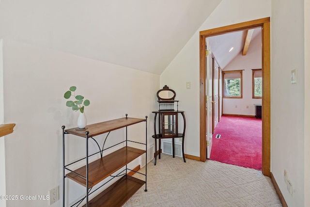 corridor with carpet flooring and baseboards