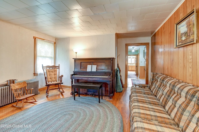 bedroom with wooden walls and wood finished floors