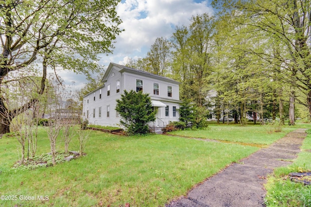 view of home's exterior with a lawn