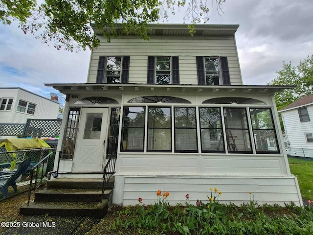1220 5th Ave, Watervliet, NY 12189 - rear view of property with a sunroom and fence
