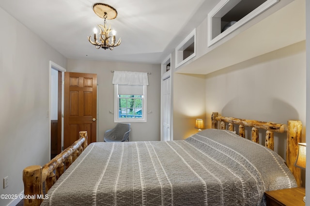 bedroom with a chandelier and a closet