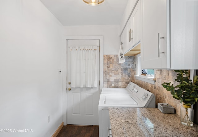 laundry area with washer and dryer and dark wood-style floors