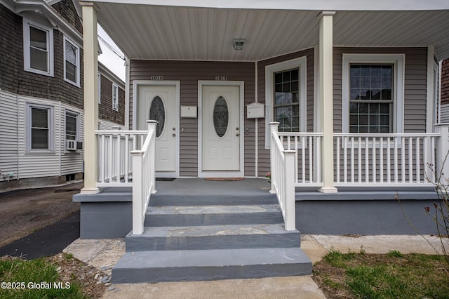 doorway to property featuring a porch