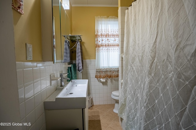 full bath featuring tile walls, tile patterned floors, toilet, crown molding, and vanity