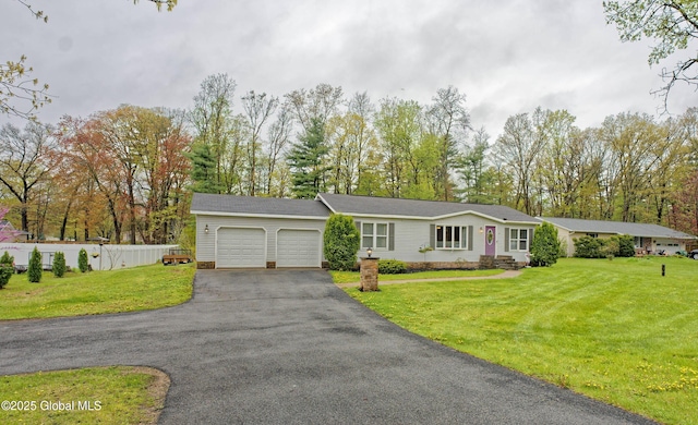 4 Kimberly Ln, Moreau, NY 12828 - ranch-style house featuring a garage, asphalt driveway, and view of scattered trees