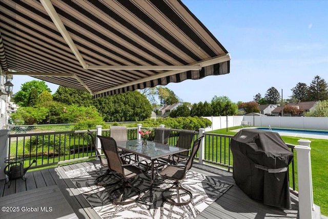 deck featuring outdoor dining area and area for grilling