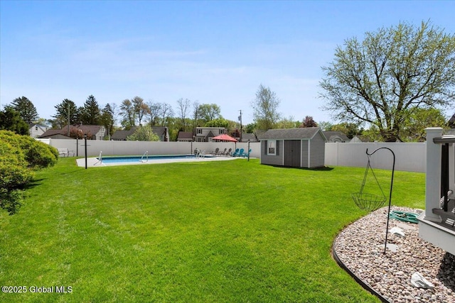 view of yard featuring a shed and an outbuilding