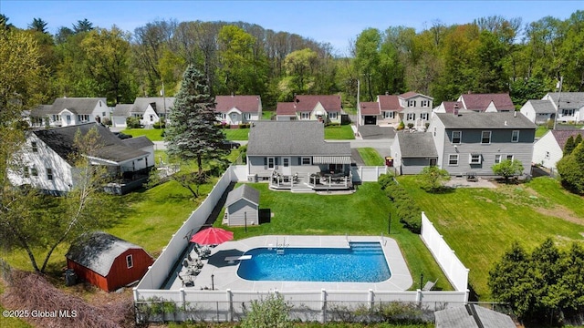 aerial view of residential area with a pool