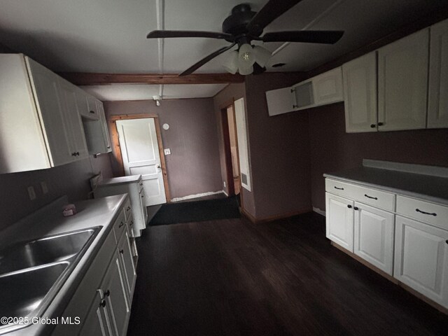 162 State Highway 67, Ephratah, NY 13339 - kitchen with a sink, ceiling fan, baseboards, dark wood-type flooring, and white cabinets