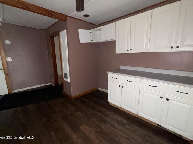 162 State Highway 67, Ephratah, NY 13339 - kitchen featuring dark wood-style floors, white cabinets, baseboards, and dark countertops