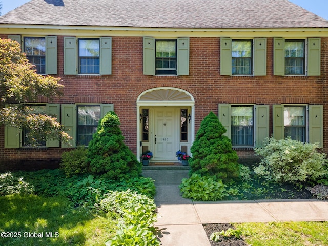 1435 Lowell Rd, Schenectady, NY 12308 - view of front of home with brick siding and roof with shingles