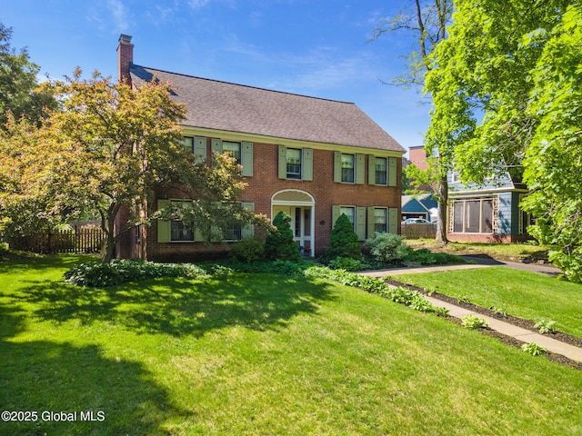 1435 Lowell Rd, Schenectady, NY 12308 - colonial house with a chimney and brick siding