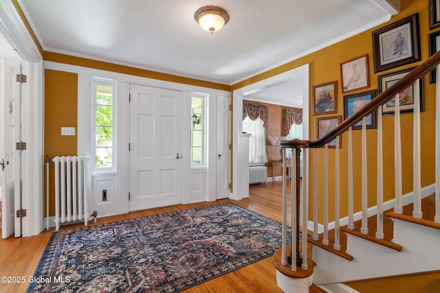 1435 Lowell Rd, Schenectady, NY 12308 - foyer with radiator, ornamental molding, stairway, wood finished floors, and baseboards