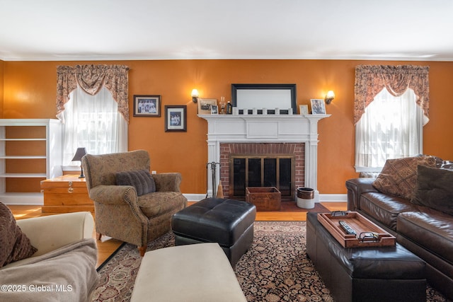1435 Lowell Rd, Schenectady, NY 12308 - living room with wood finished floors, a fireplace, and crown molding
