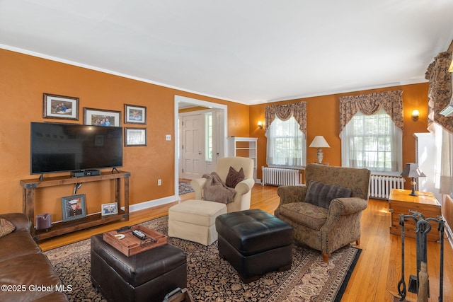 1435 Lowell Rd, Schenectady, NY 12308 - living area featuring radiator heating unit, wood finished floors, and ornamental molding