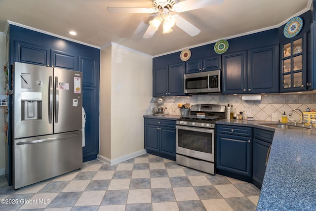 1435 Lowell Rd, Schenectady, NY 12308 - kitchen with appliances with stainless steel finishes, a sink, baseboards, blue cabinetry, and ornamental molding