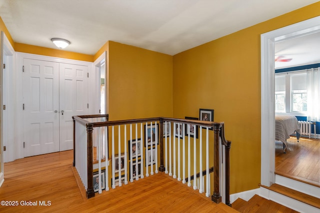 1435 Lowell Rd, Schenectady, NY 12308 - hallway with an upstairs landing, wood finished floors, and baseboards