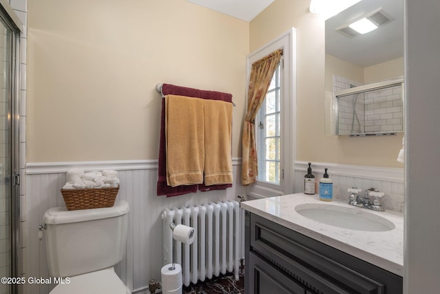 1435 Lowell Rd, Schenectady, NY 12308 - full bathroom featuring radiator, a wainscoted wall, toilet, a tile shower, and vanity