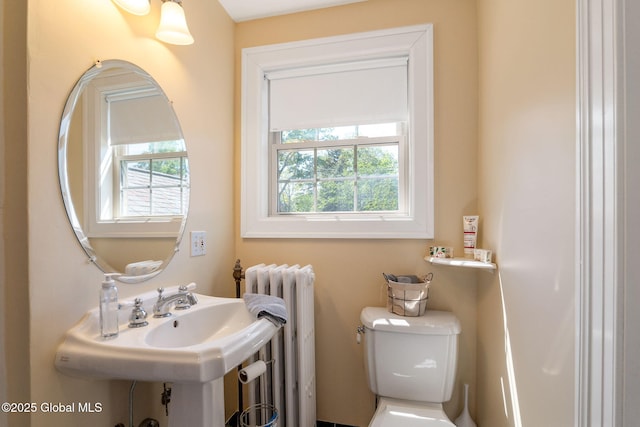 1435 Lowell Rd, Schenectady, NY 12308 - half bath featuring radiator, toilet, and a sink