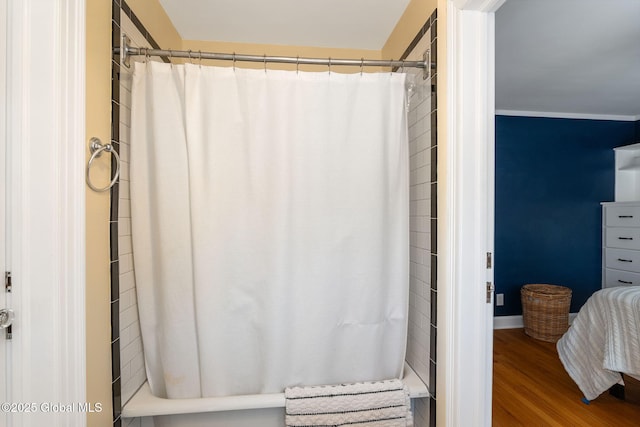 1435 Lowell Rd, Schenectady, NY 12308 - full bathroom with wood finished floors and a shower with shower curtain