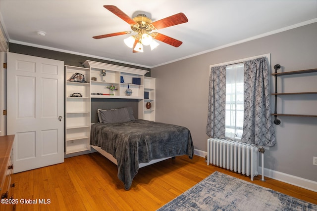 1435 Lowell Rd, Schenectady, NY 12308 - bedroom featuring radiator, baseboards, light wood-type flooring, crown molding, and a ceiling fan