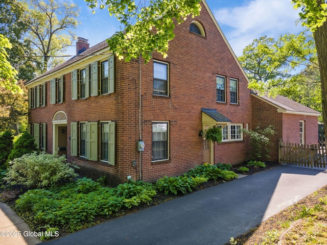 1435 Lowell Rd, Schenectady, NY 12308 - view of side of home featuring a chimney and brick siding