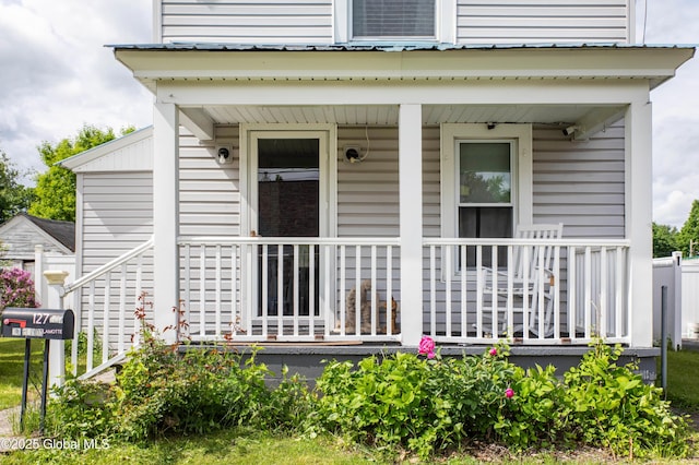 127 John St, Hudson Falls, NY 12839 - view of exterior entry featuring covered porch