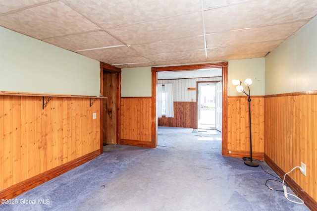 127 John St, Hudson Falls, NY 12839 - carpeted spare room featuring wainscoting and wood walls
