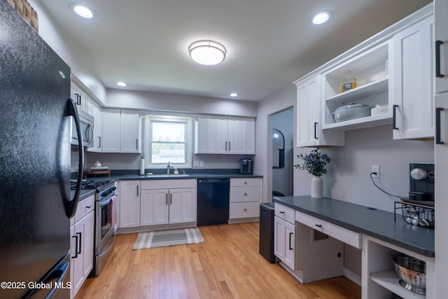 kitchen with black appliances, open shelves, a sink, dark countertops, and recessed lighting