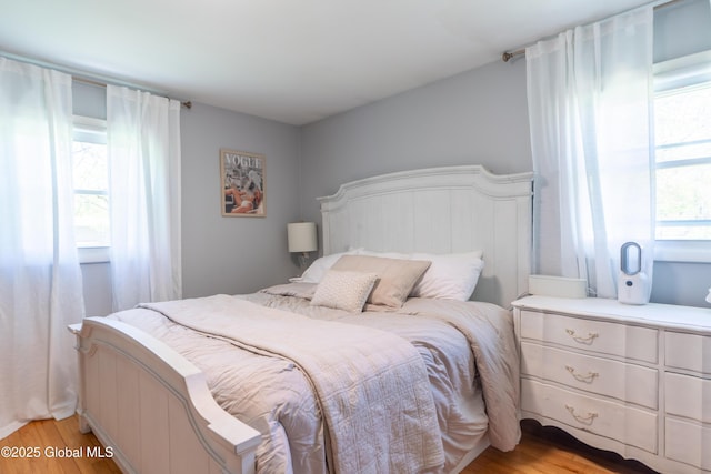 bedroom with light wood-type flooring