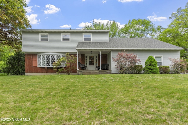 15 Oak Tree Ln, Colonie, NY 12309 - rear view of property with a lawn, brick siding, a porch, and roof with shingles